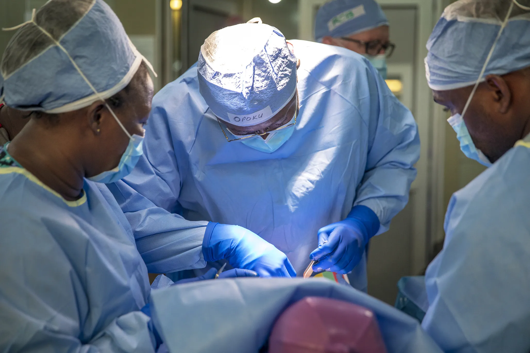 Operation Smile Ghana medical director and cleft surgeon Dr. Opoku Ampomah, center, performs surgery during Operation Smile's 2018 surgical program in Koforidua, Ghana.