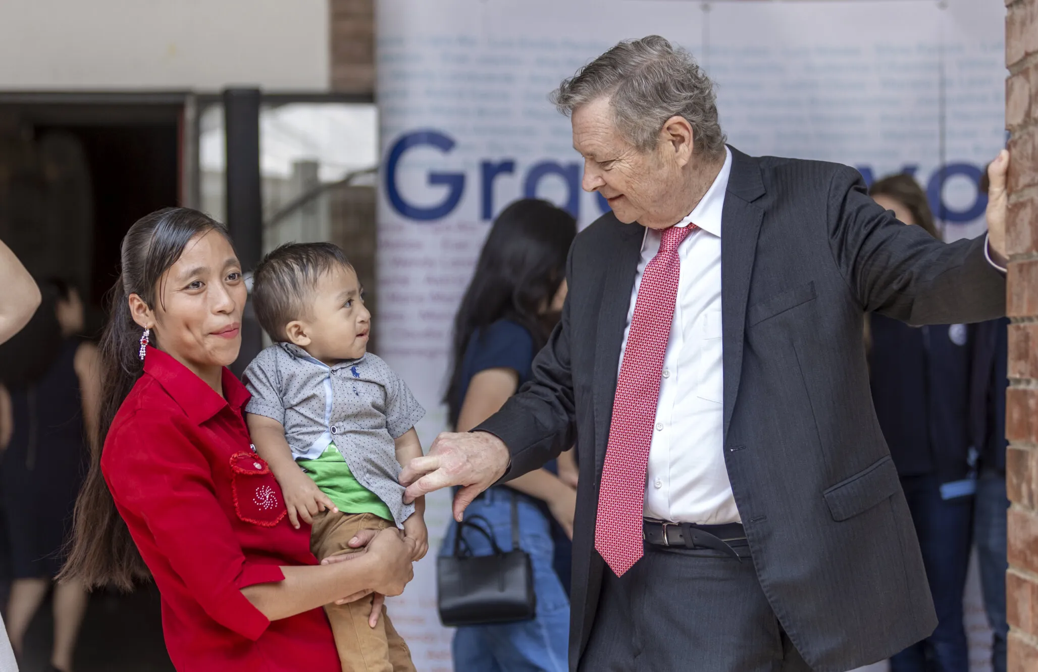 During the center’s inauguration, Dr. Bill Magee shares a sweet moment with Jobito and his mother, Lilia. Jobito received his new smile during a May 2022 surgical program.