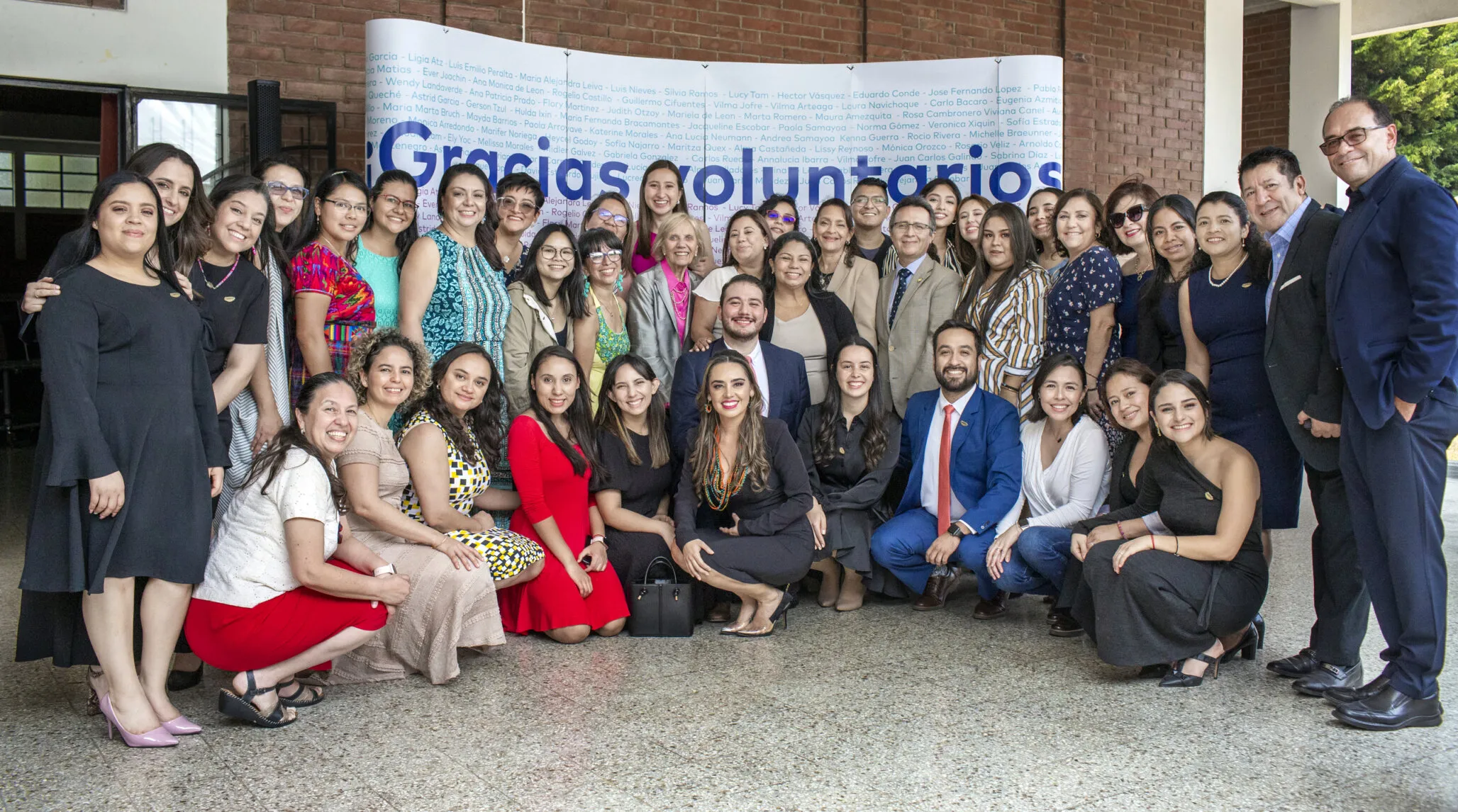 Bea Vidal is surrounded by her passionate team of Operation Smile Guatemala staff and volunteers.