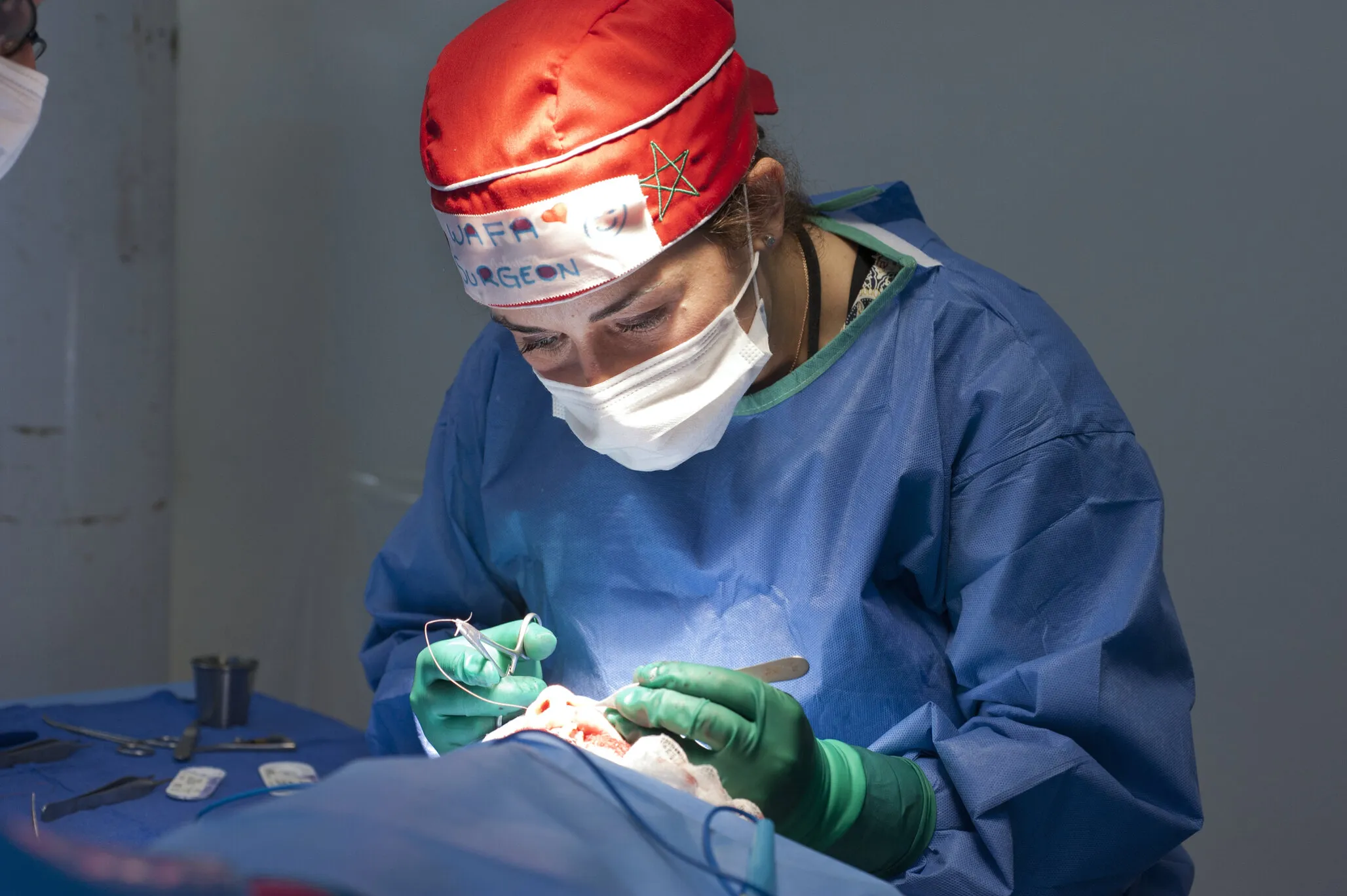 Longtime Operation Smile Morocco volunteer Dr. Wafaa Mradmi performs surgery on Siham during the Dakhla surgical program.