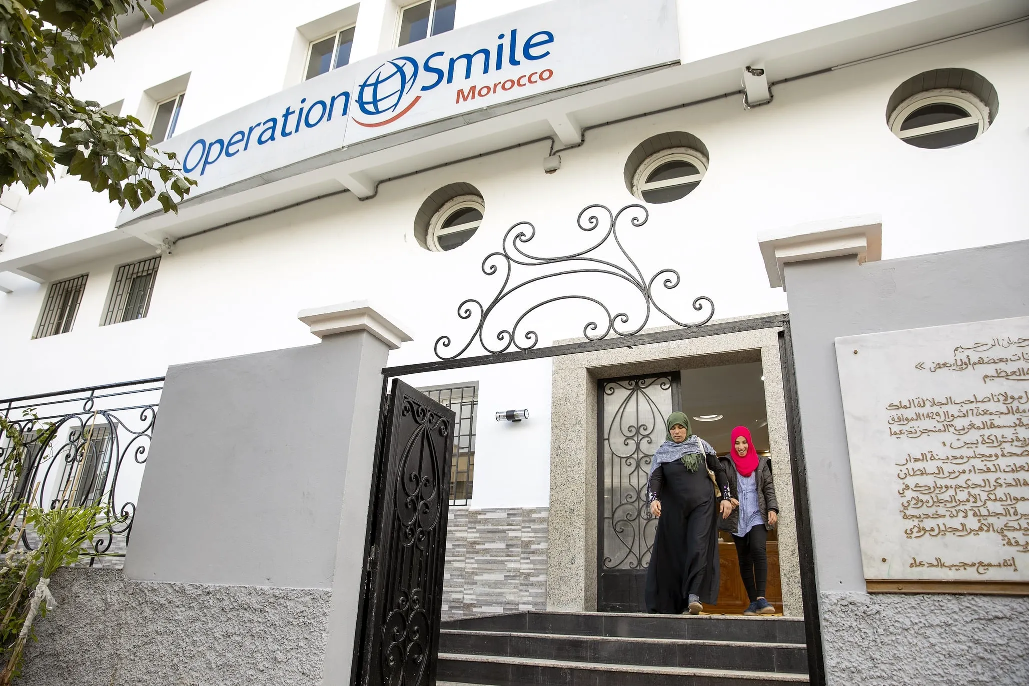 Siham and her mother exit the Operation Smile Morocco care center in Casablanca.