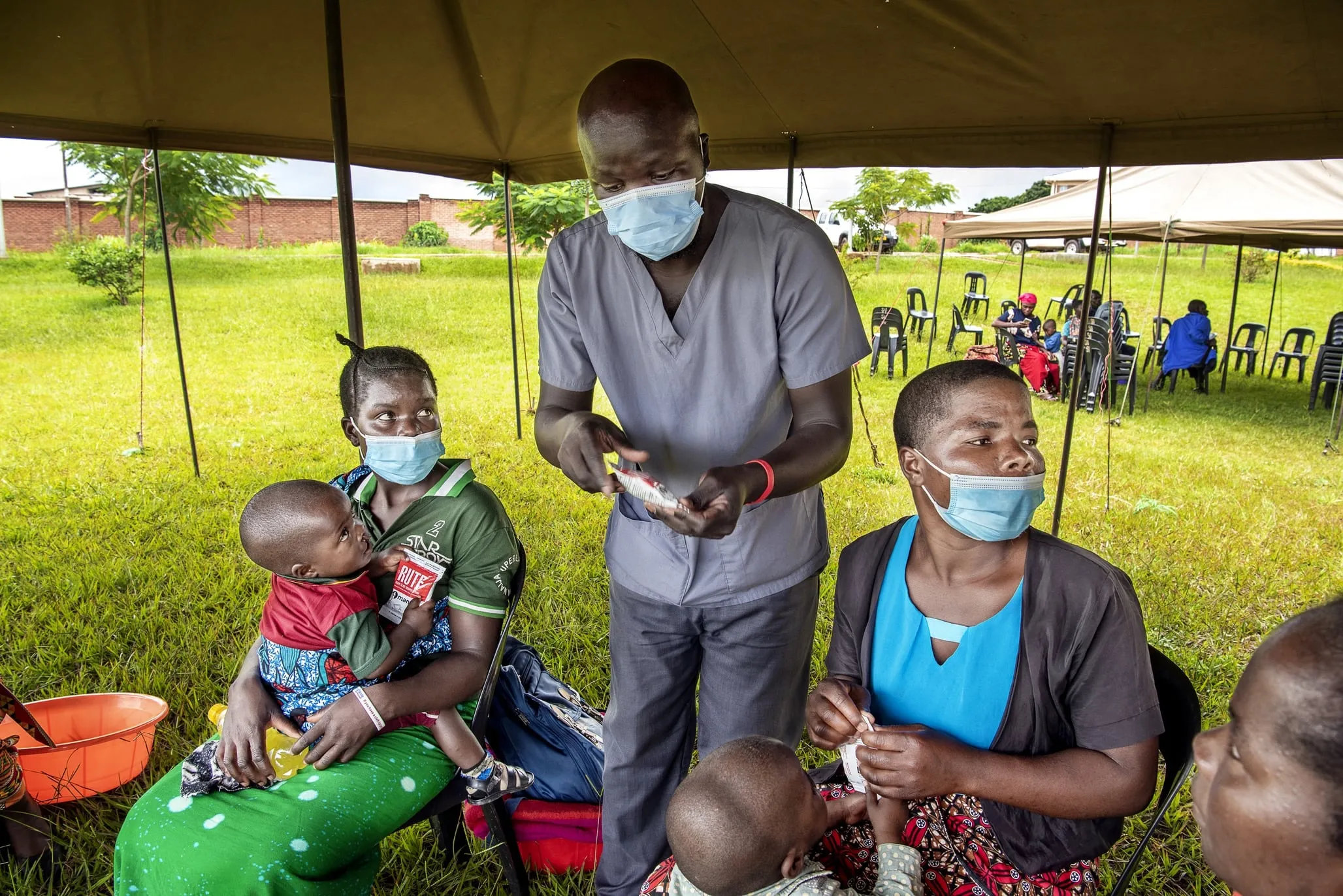 An Operation Smile nutritionist works with patients and discusses RUTF.