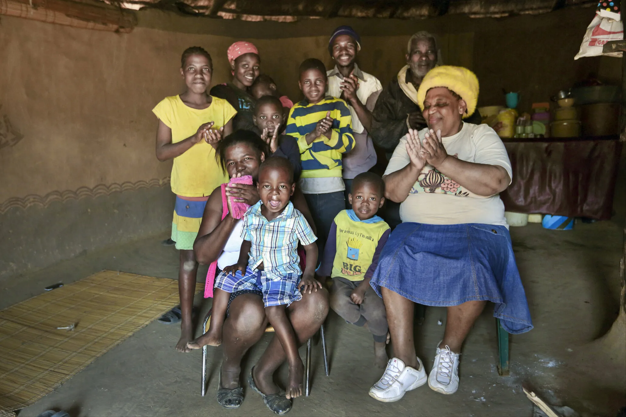 Nurse Funeke Cele poses with patients and family members in South Africa.