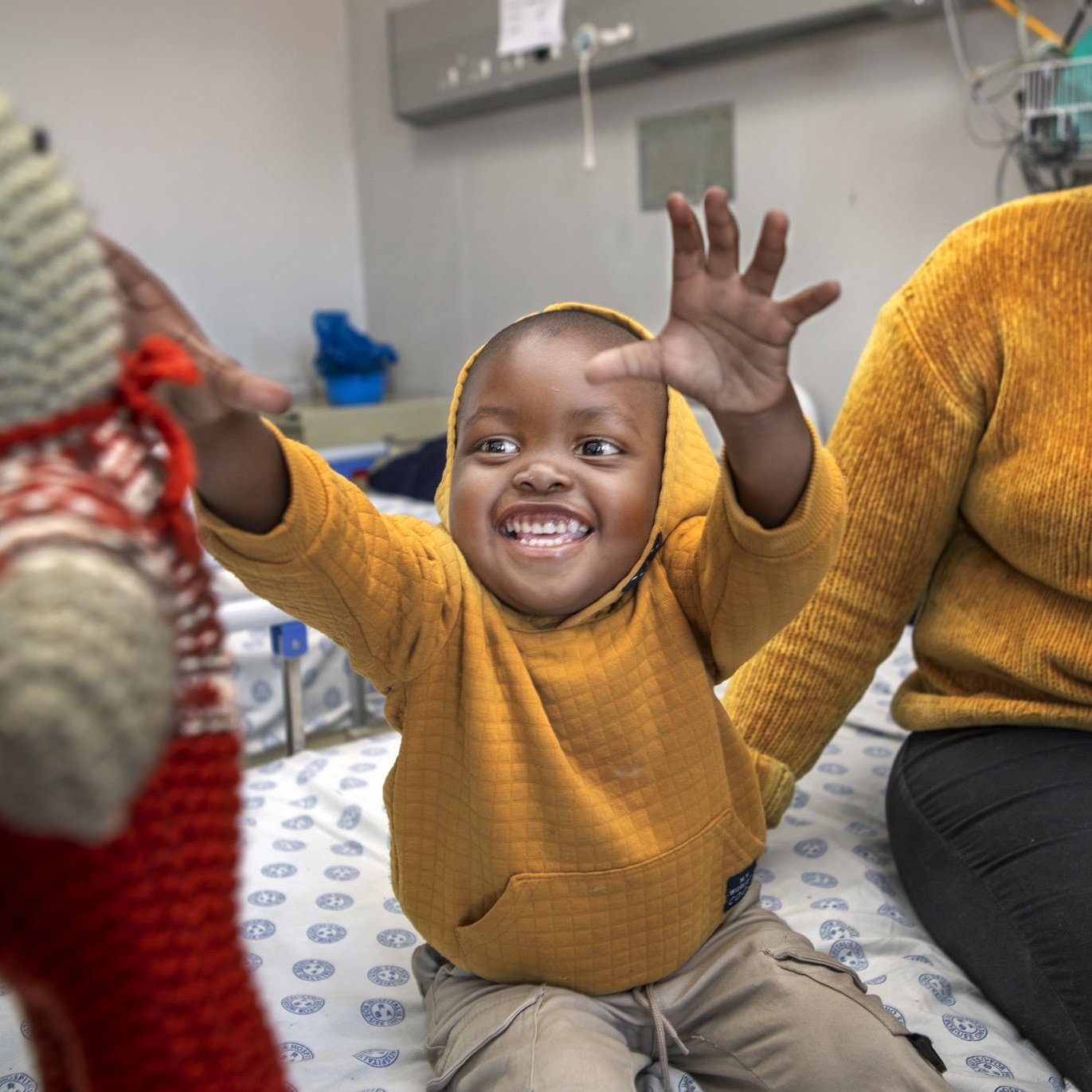 Seipati reaches for a toy during a surgical program in South Africa.