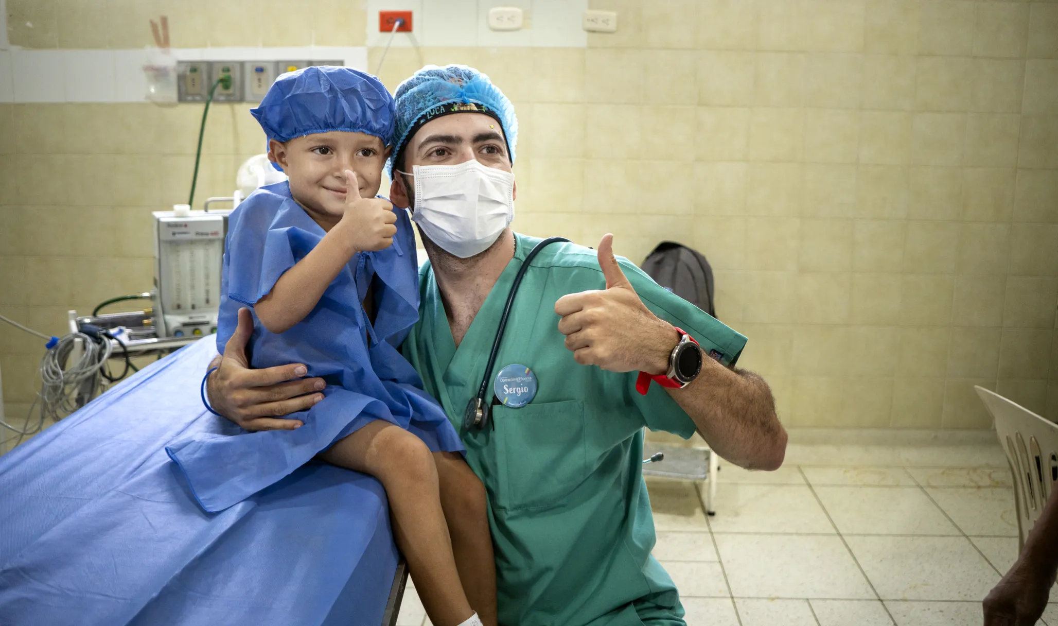 An anesthesiologist poses with his patient during a surgical program in Colombia.