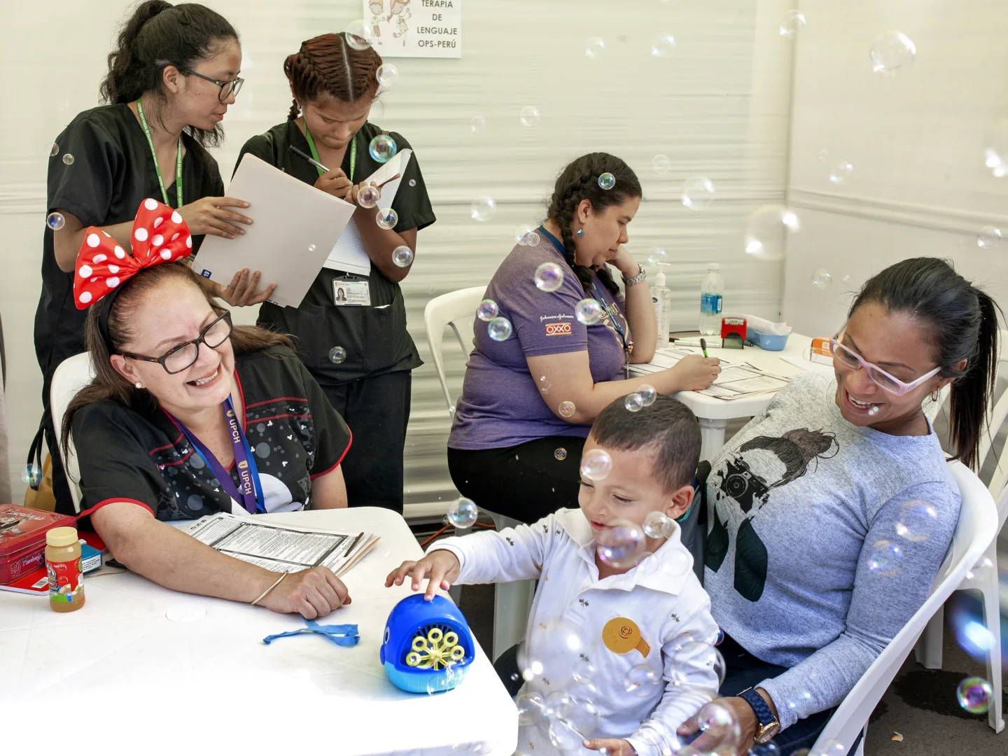 Speech therapist Milagros Rojas works with a patient.