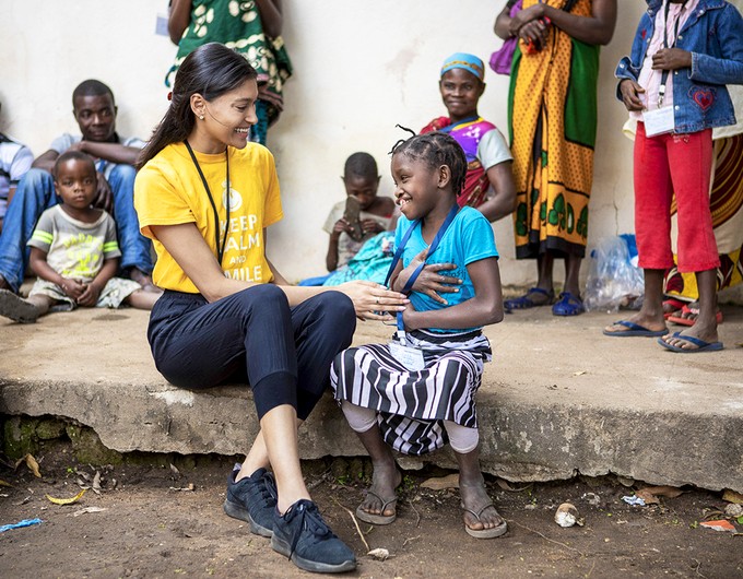 Operation Smile global ambassador Pritika Swarup shares a smile with a young patient during a 2019 medical program in Nampula, Mozambique. Operation Smile Photo - Zeke du Plessis