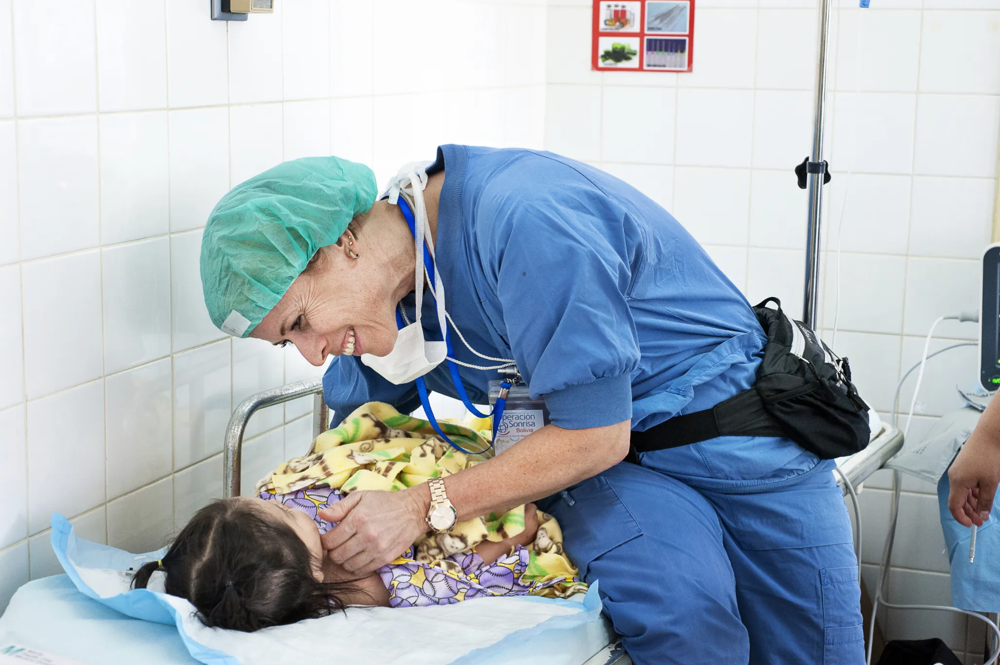 Volunteer pre- and post-operative nurse Asa Ostberg of Sweden checks on how Annika is feeling after her surgery.