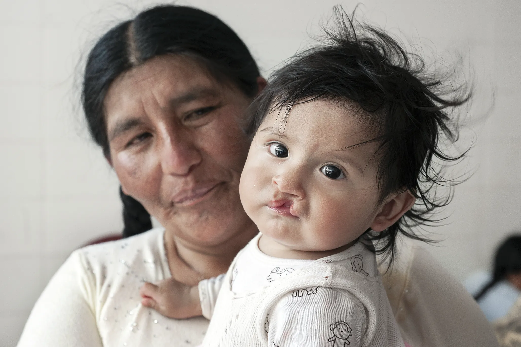 Eight-month-old Heydi with her grandmother, Claudina.