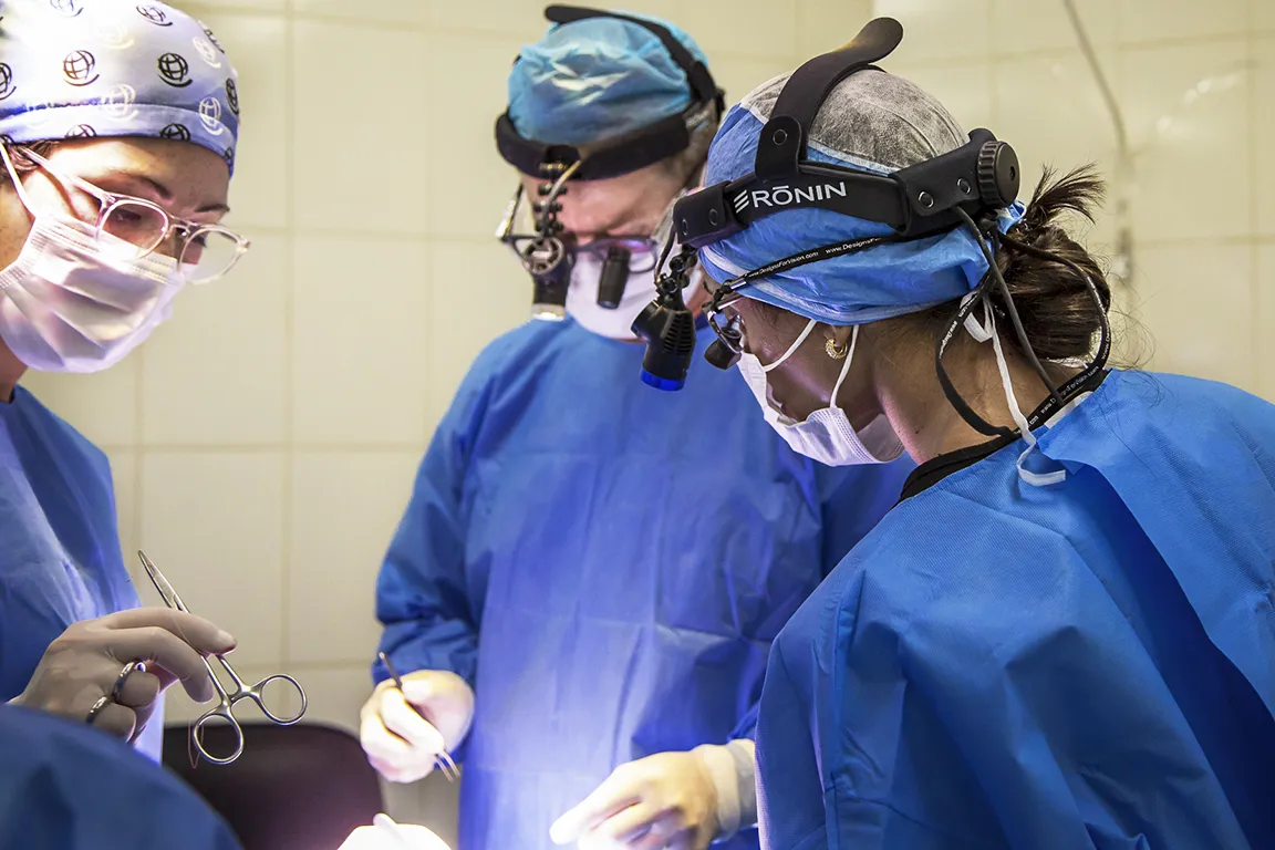 Surgeons treat a patient during a surgical program in Bolivia.