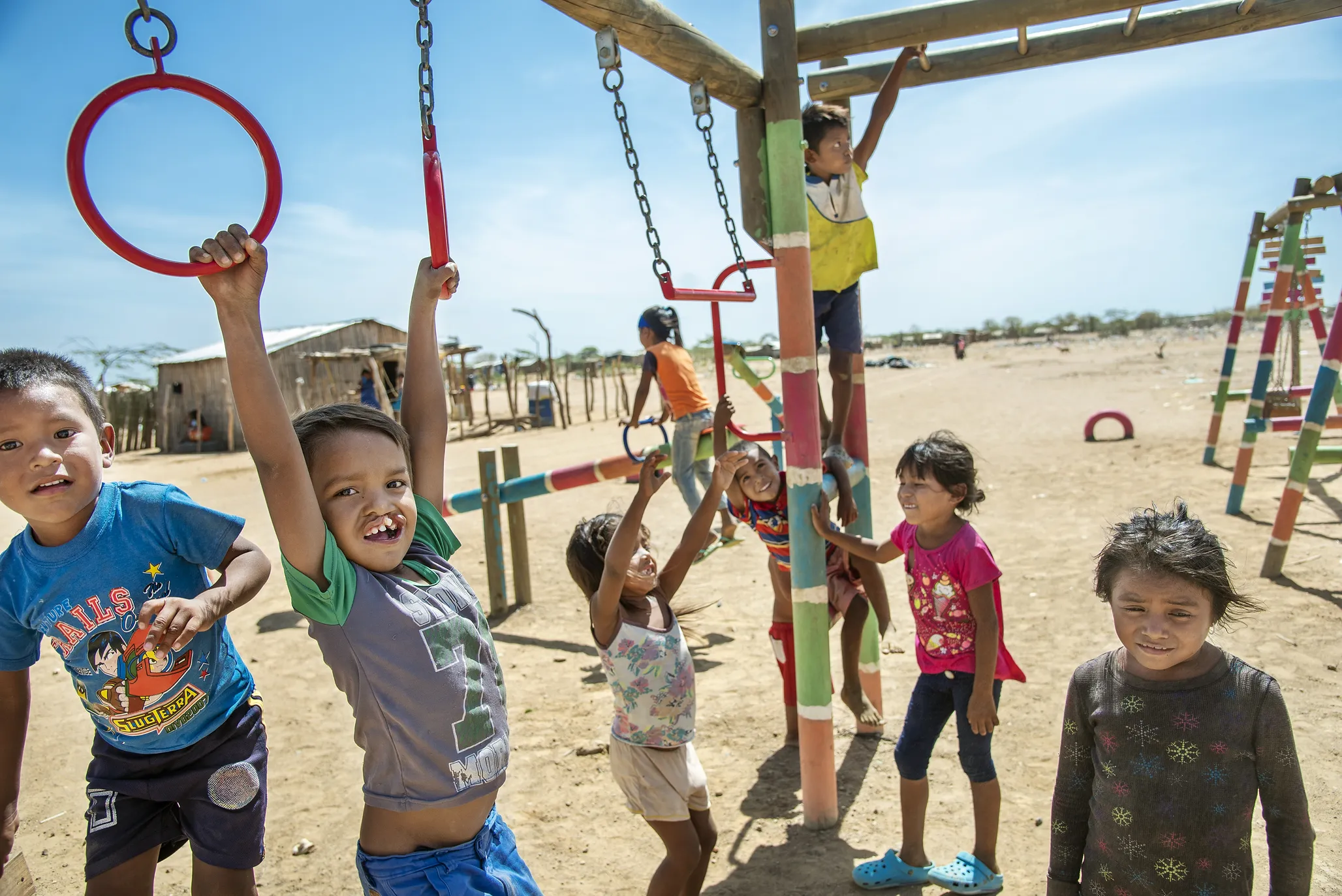 Pedro and his friends play at the April Third refugee camp in Uribia, Colombia.