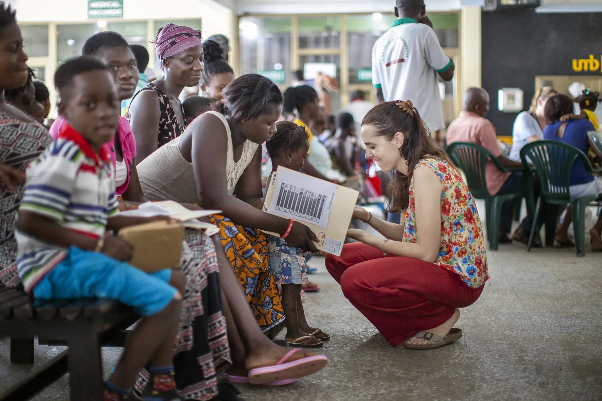 Sabrina Ghiddi, Operation Smile's regional manager of western and southern Africa, talks to patients and families during a 2017 surgical program.