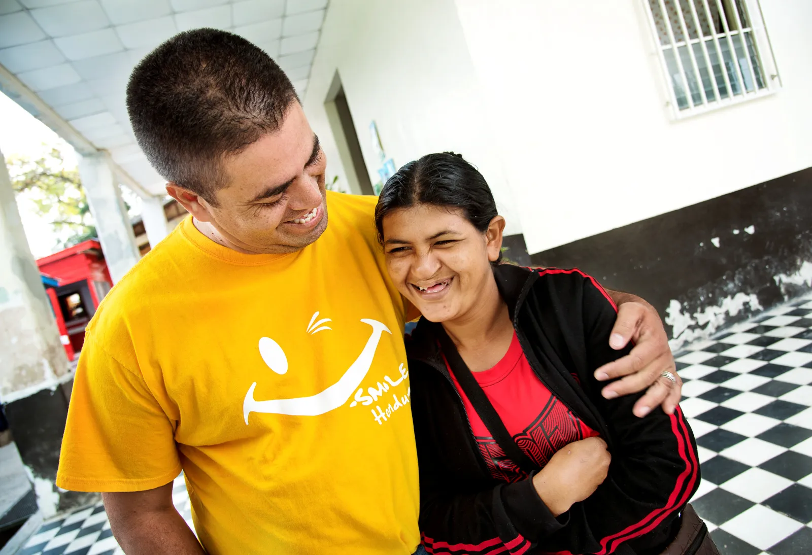 Patient Advocate Alex Guerrero with Santa Avila, a tortilla seller and a patient he found in his town and brought to Operation Smile's program at Hospital General San Felipe in Tegucigalpa, Honduras February 20, 2016.