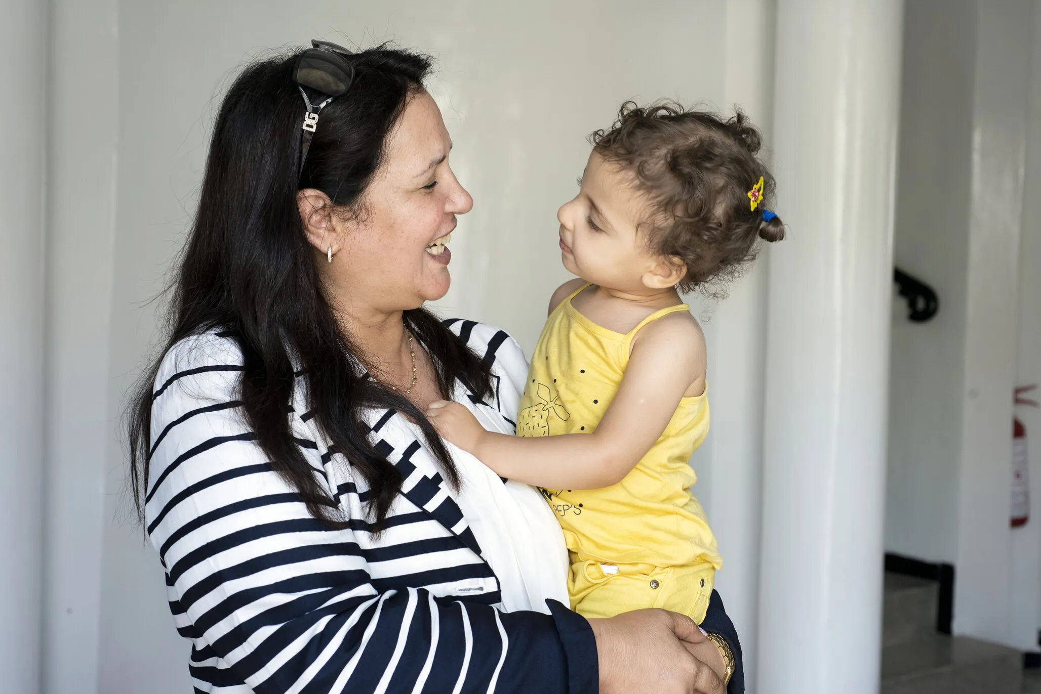 Vice President Fouzia shares a moment with a patient.