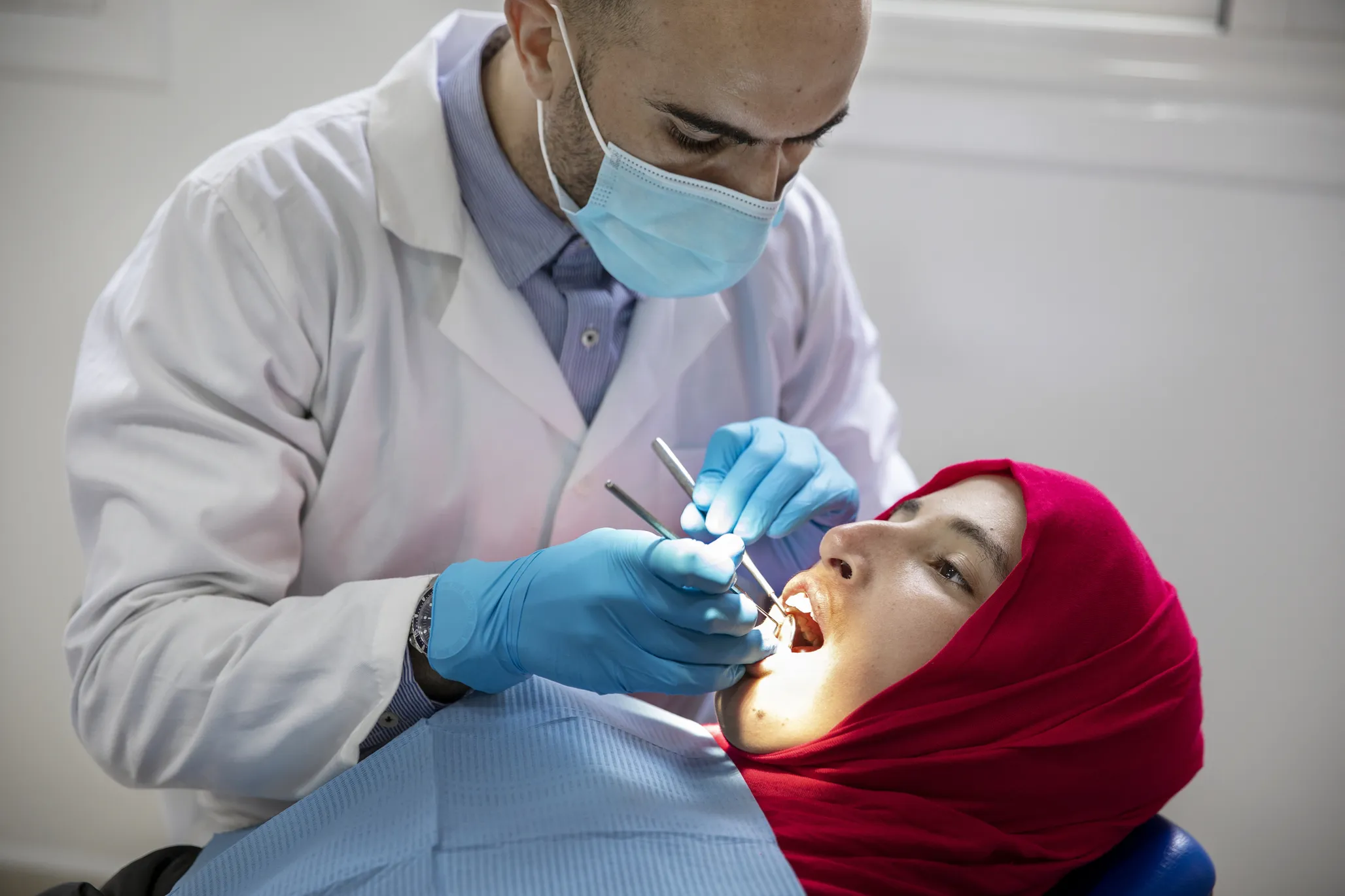 Siham, 16 years old, attends her follow-up dental appointment with volunteer orthodontist Dr. Abderrahmane Harouga at Operation Smile Morocco's Casablanca care center.