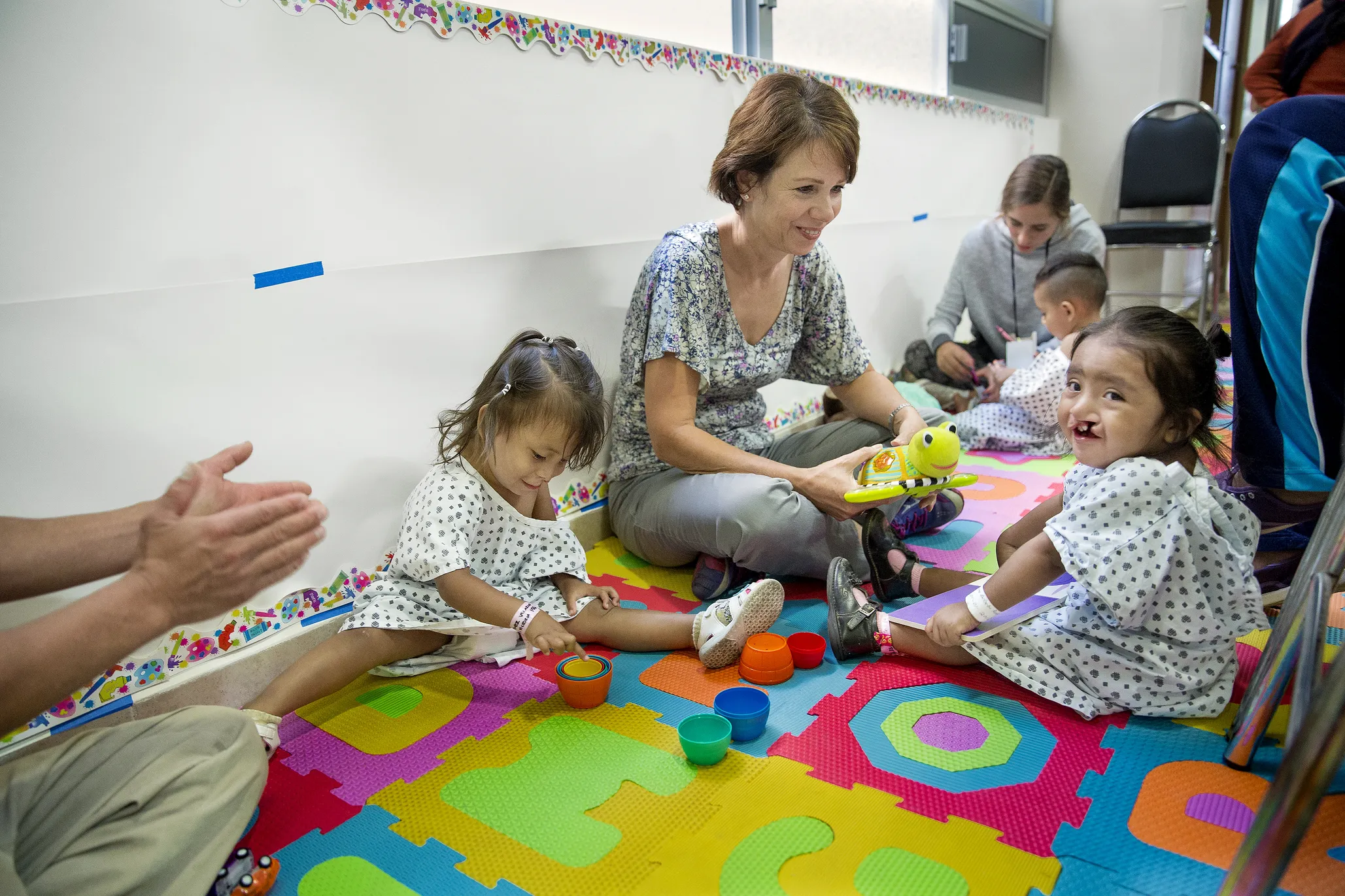 Karla enjoys singing and playing with local volunteers in the child life area.