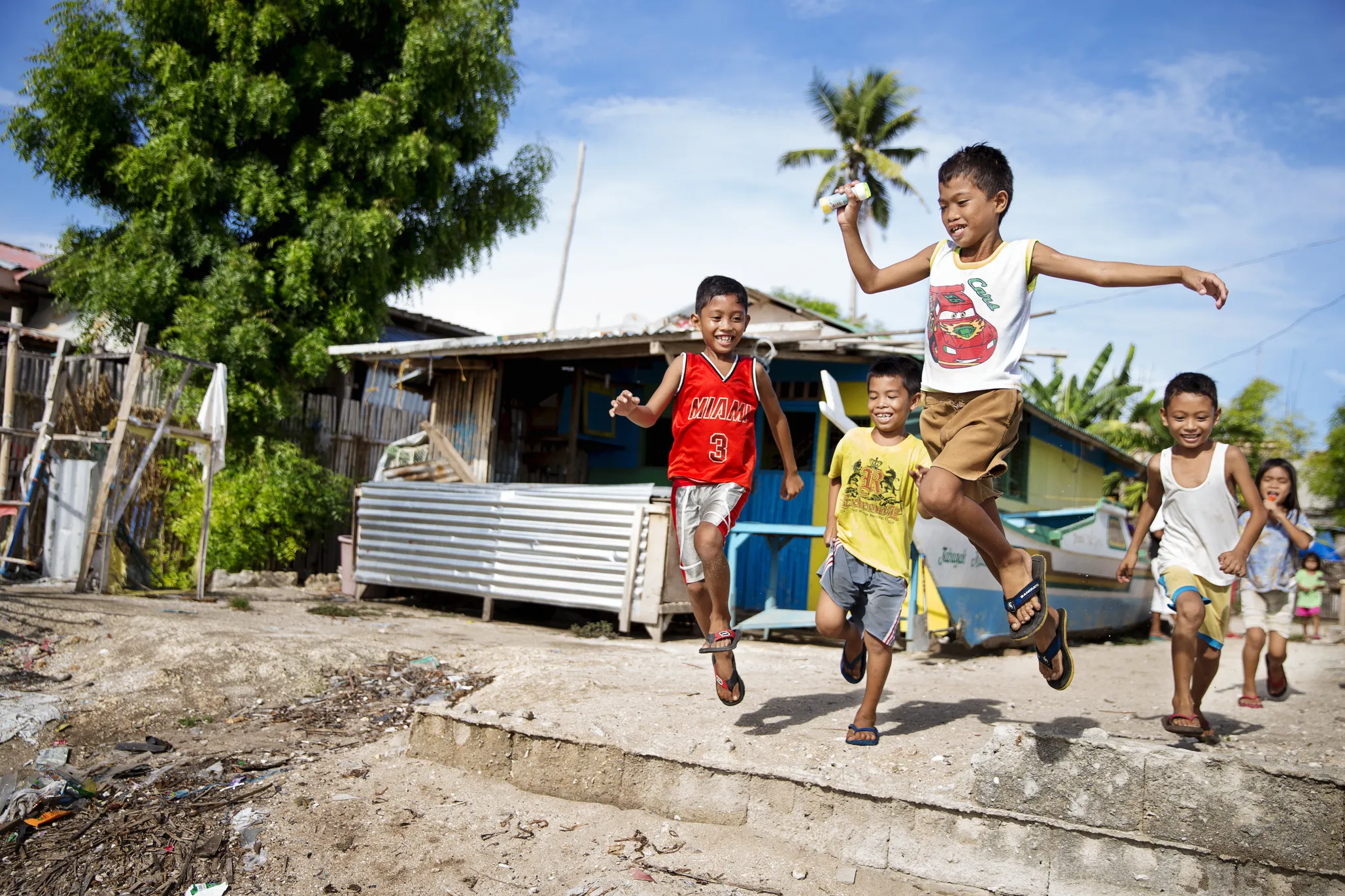 Efren jumps down while playing with friends.