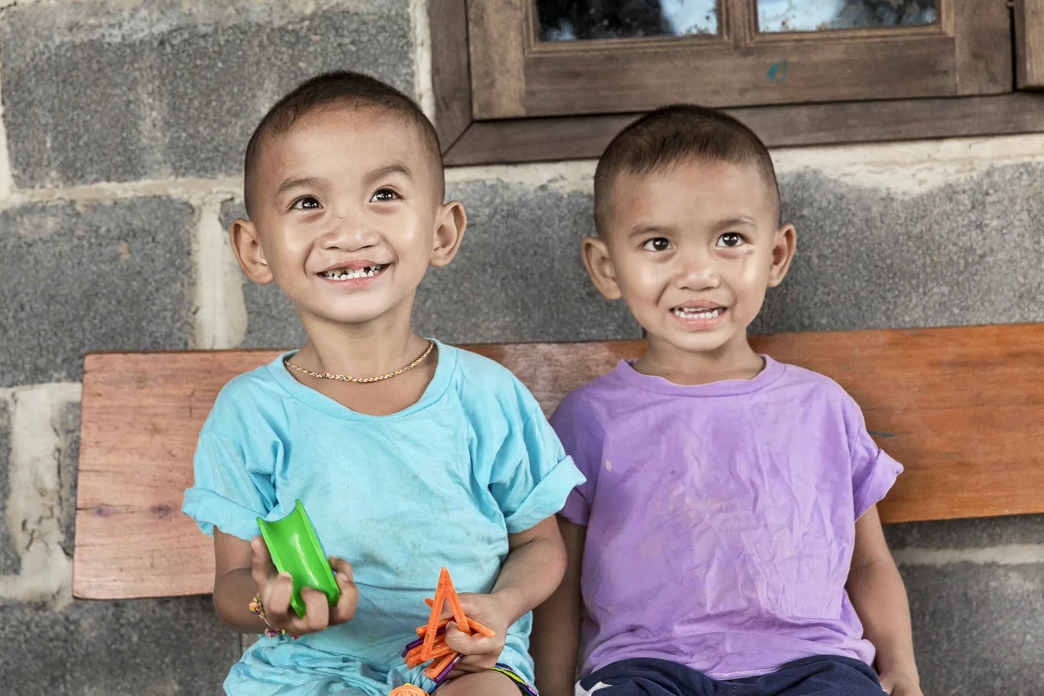 Ou, left, and Lak, one year after their cleft lip surgeries.