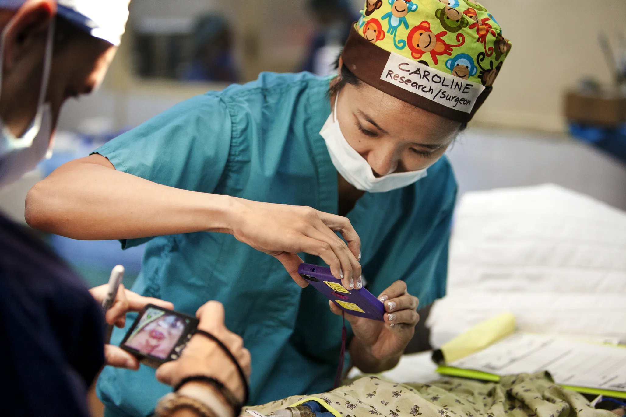 Dr. Caroline Yao takes a photo of a patient during a surgical program in Vietnam.